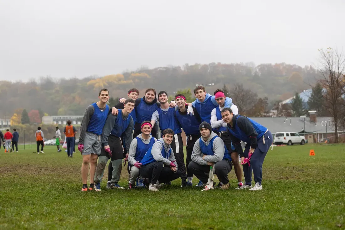 Students playing sports in a field.